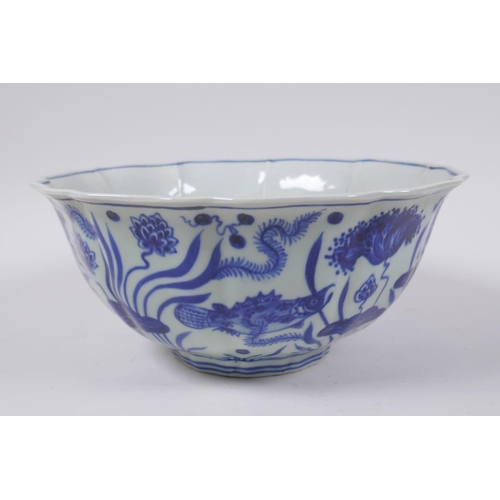 70 - A blue and white porcelain bowl of lobed form decorated with carp in a lotus pond, Chinese Xuande 6 ... 