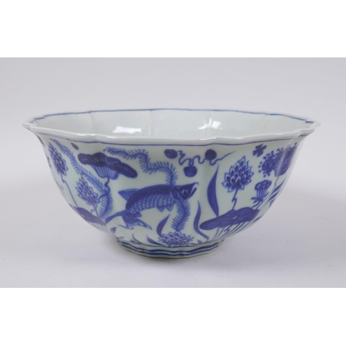 70 - A blue and white porcelain bowl of lobed form decorated with carp in a lotus pond, Chinese Xuande 6 ... 