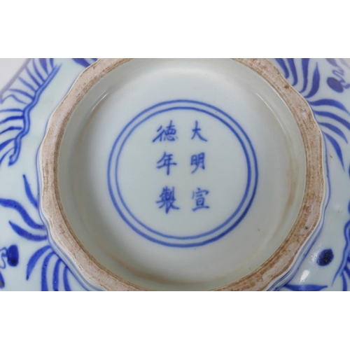 70 - A blue and white porcelain bowl of lobed form decorated with carp in a lotus pond, Chinese Xuande 6 ... 