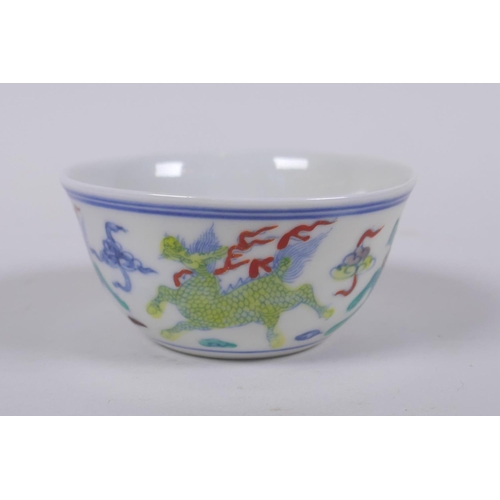 73 - A doucai porcelain tea bowl with kylin decoration, Chinese Chenghua 6 character mark to base, 8cm wi... 