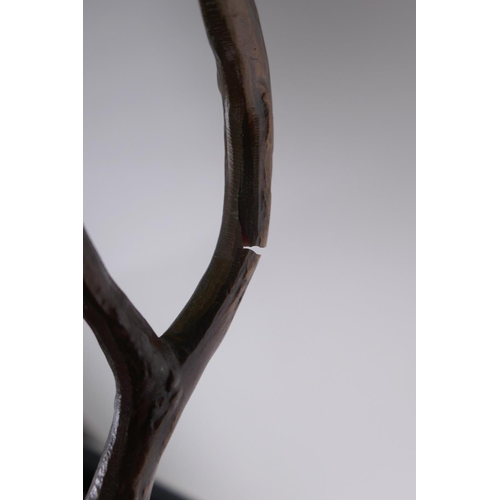 74 - A bronzed composition lamp in the form of a stag, 62cm high without shade