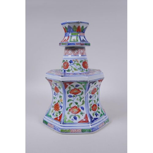 78 - A Chinese wucai porcelain candlestick of octagonal form with decorative floral panels, 28cm high, AF