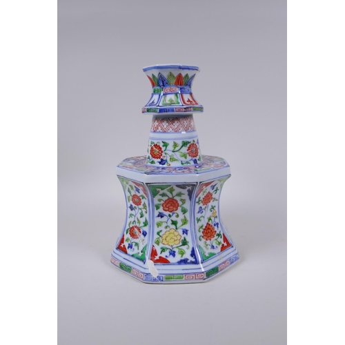 78 - A Chinese wucai porcelain candlestick of octagonal form with decorative floral panels, 28cm high, AF