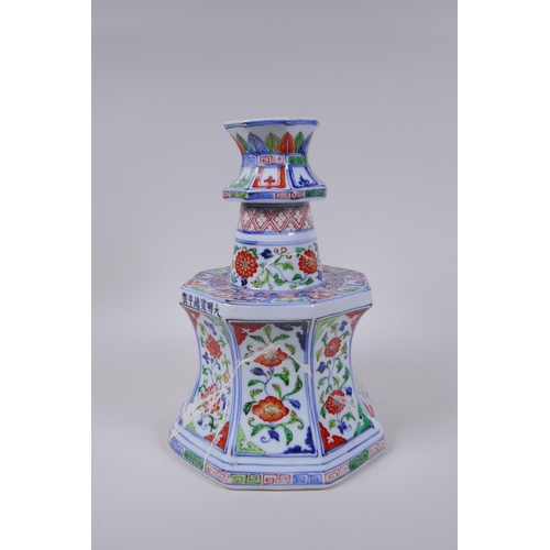 78 - A Chinese wucai porcelain candlestick of octagonal form with decorative floral panels, 28cm high, AF