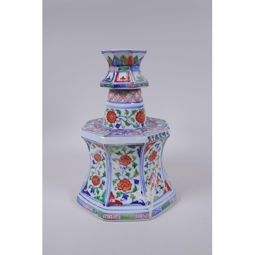 78 - A Chinese wucai porcelain candlestick of octagonal form with decorative floral panels, 28cm high, AF