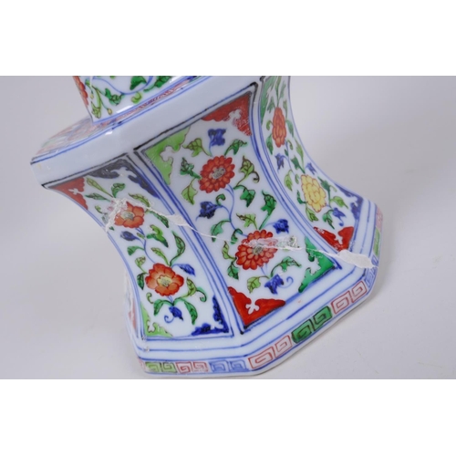 78 - A Chinese wucai porcelain candlestick of octagonal form with decorative floral panels, 28cm high, AF