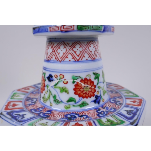 78 - A Chinese wucai porcelain candlestick of octagonal form with decorative floral panels, 28cm high, AF