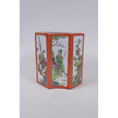 83 - A Chinese shaped porcelain brush pot with famille vert decorative panels depicting figures and flowe... 