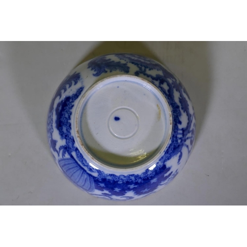 84 - An C18th/C19th pearlware bowl with blue and white transfer decoration of harebells, repairs to foot,... 