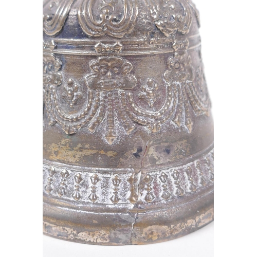 86 - A Sino Tibetan silvered metal ceremonial bell with vajra decoration to handle, 18cm high