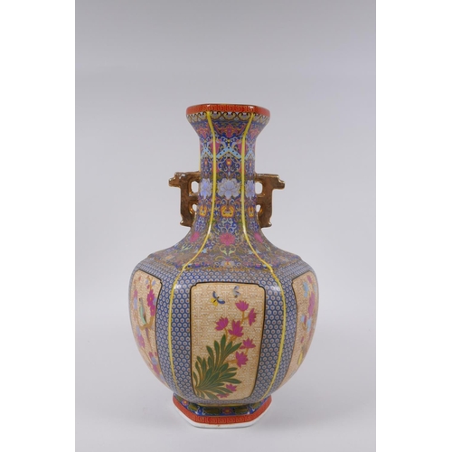 90 - A Chinese polychrome porcelain two handled vase with decorative panels depicting birds, butterflies ... 