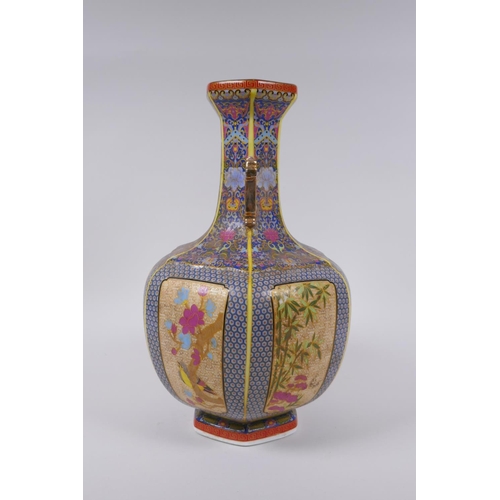 90 - A Chinese polychrome porcelain two handled vase with decorative panels depicting birds, butterflies ... 