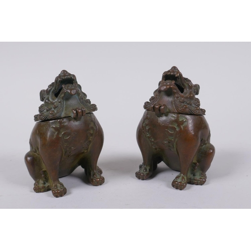 92 - A pair of Japanese censers and covers in the form of temple lions, marks to base, 7cm high