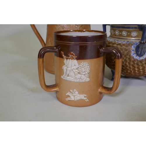 96 - A Royal Doulton stoneware jug, AF, a hunting jug and tyg, and another, largest 22cm high