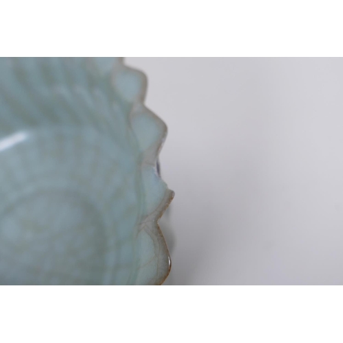 98 - A Chinese celadon crackle glazed porcelain bowl of ribbed form, with flared rim, AF chip to rim, 17c... 