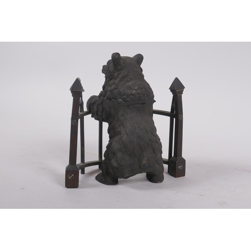 1 - A C19th finely cast patinated bronze inkwell in the form of a bear behind railings, 12cm high