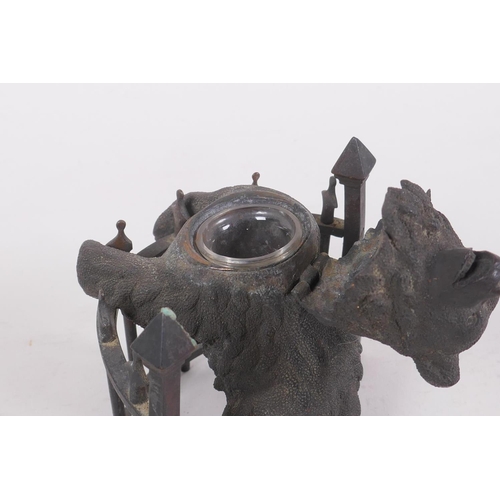 1 - A C19th finely cast patinated bronze inkwell in the form of a bear behind railings, 12cm high