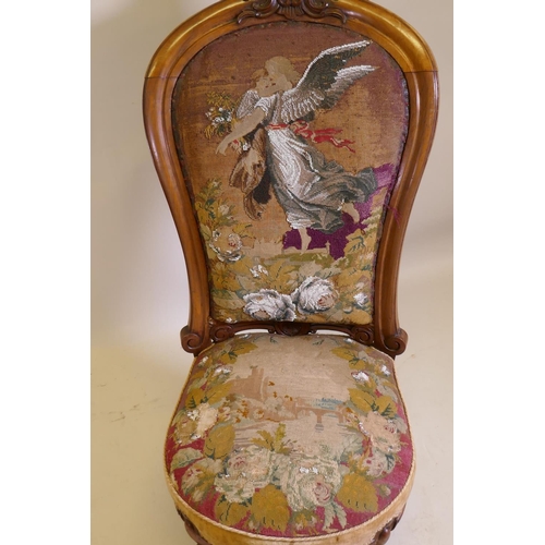 1017 - A Victorian walnut nursing chair with carved crest and shaped back, beadwork upholstery, raised on c... 