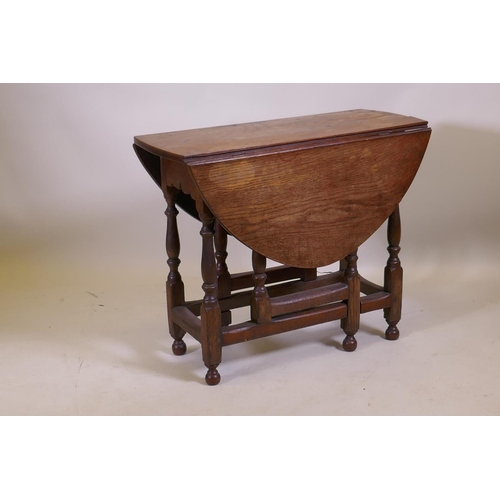 1019 - A C19th oak gateleg table with a single drawer, 76 x 34cm, 62cm high, 76 x 96cm extended