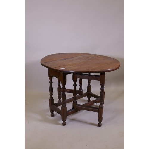 1019 - A C19th oak gateleg table with a single drawer, 76 x 34cm, 62cm high, 76 x 96cm extended