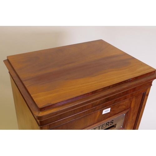 1025 - A Victorian figured mahogany letter box, the single door with a brass letter slot and fielded panel,... 