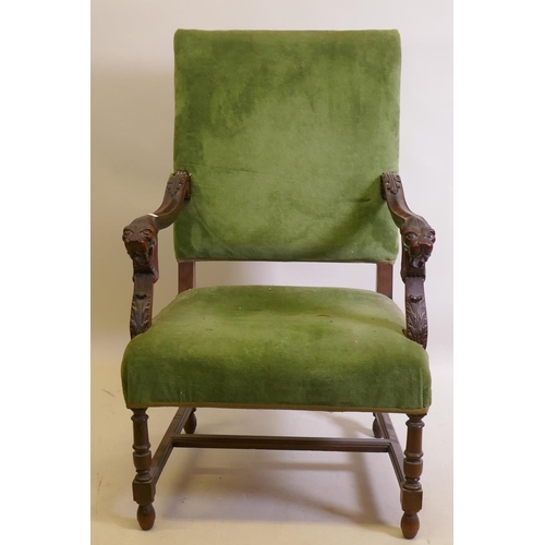 1029 - A C19th high back open arm chair with carved lion mask arms, raised on turned supports, AF