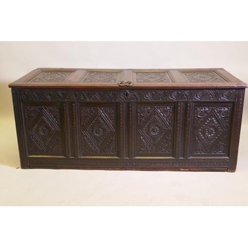 1031 - An C18th continental carved oak four panel coffer, 157 x 65cm, 63cm high