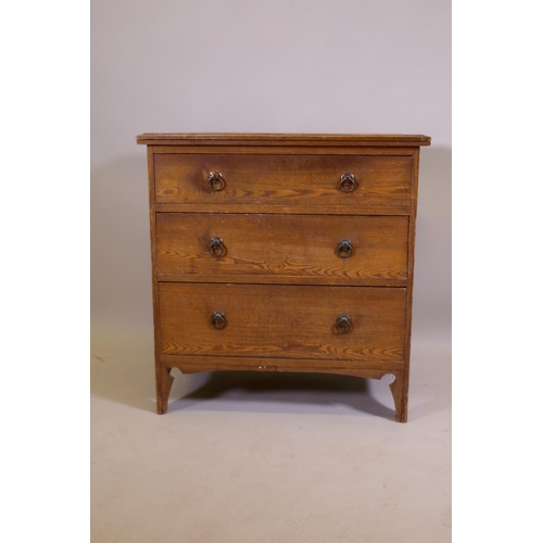 1034 - An Arts & Crafts oak three drawer chest, raised on shaped supports, 74 x 49 x 77cm