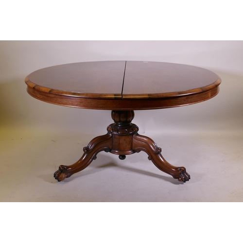 1037 - A Victorian rosewood tilt top breakfast table, raised on turned column tripod supports and carved cl... 