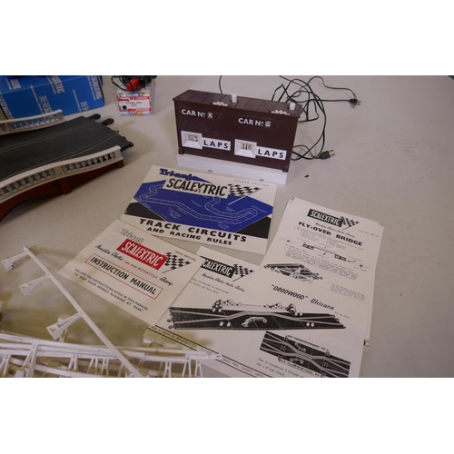 104 - A 1962 Triang Scalextric set CM34 with lights, including a Lister Jaguar C.56, and an Aston Martin C... 