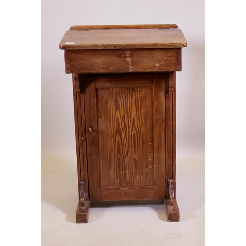 1041 - An antique pine clerk's desk, 56 x 42cm, 93cm high