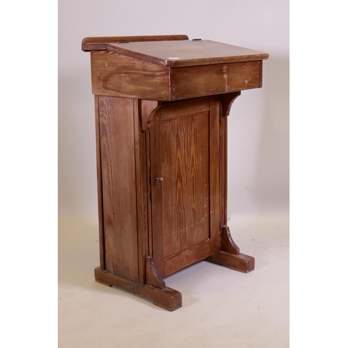 1041 - An antique pine clerk's desk, 56 x 42cm, 93cm high