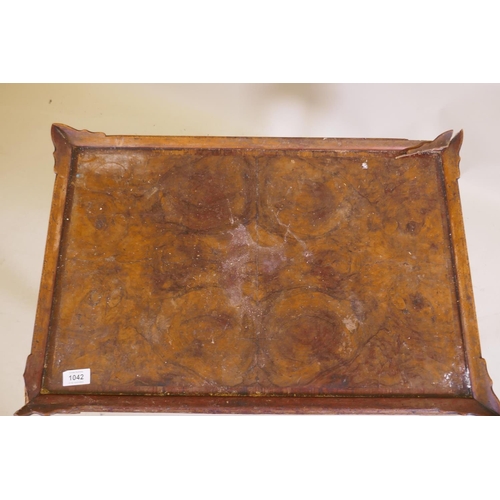 1042 - A figured walnut occasional table, with shaped gallery and cushion shaped frieze, raised on cabriole... 