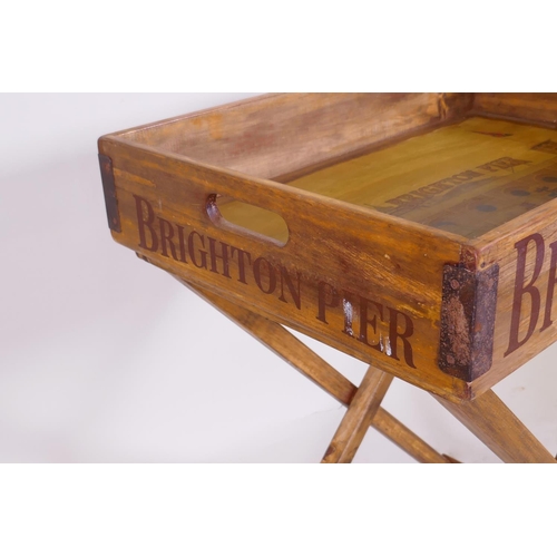 1046 - A rustic style butler's tray and stand, with Brighton Pier decoration, 44 x 65cm