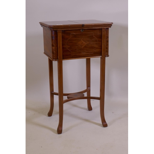 1048 - An Edwardian inlaid mahogany work table, the fold over top opening to reveal a fitted interior with ... 