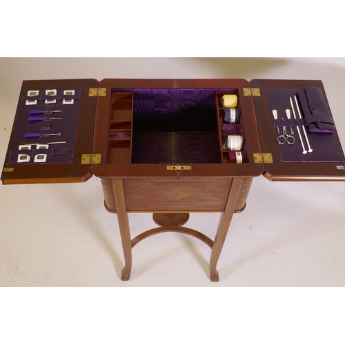 1048 - An Edwardian inlaid mahogany work table, the fold over top opening to reveal a fitted interior with ... 