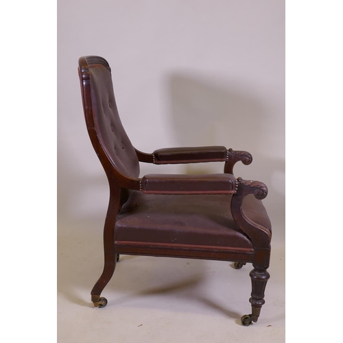 1053 - A C19th mahogany show frame armchair with reeded frame and carved and scrolled arms, raised on turne... 