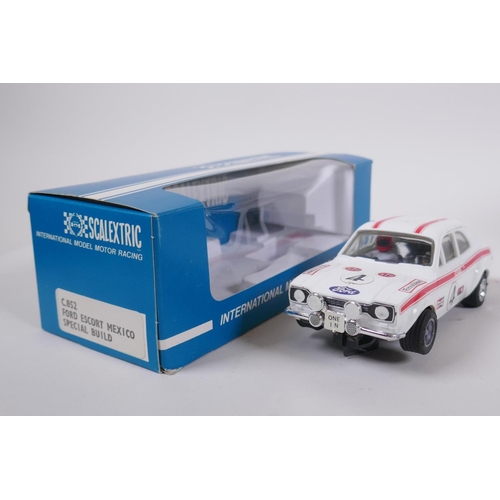 106 - Four 1970s Scalextric cars to include two Mini Cooper C.007 in red and yellow, a Datsun 260Z C.053 a... 