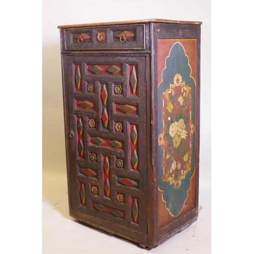 1060 - An early C19th east European painted pine cupboard, with moulded decoration, single drawer over cupb... 