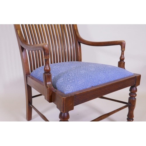 1064 - A Liberty & Co, Arts and Crafts  walnut bedroom chair with slat back and reeded frieze, raised o... 