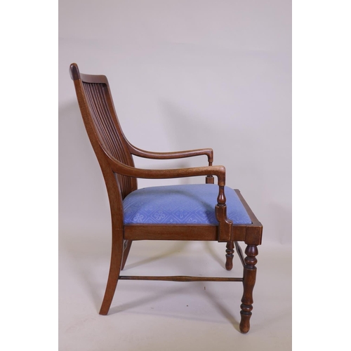 1064 - A Liberty & Co, Arts and Crafts  walnut bedroom chair with slat back and reeded frieze, raised o... 