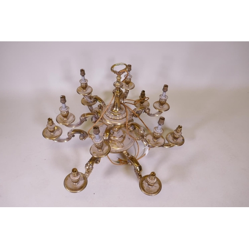 1067 - A gilt brass two tier twelve branch electrolier, 84cm diameter