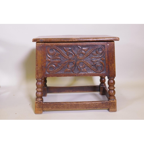 1069 - A carved oak box stool, coal box, gout stool, and oak stool with tapestry seat, raised on barleytwis... 