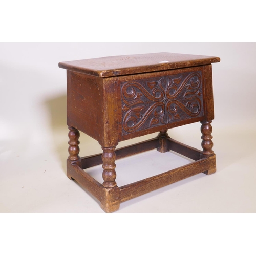 1069 - A carved oak box stool, coal box, gout stool, and oak stool with tapestry seat, raised on barleytwis... 