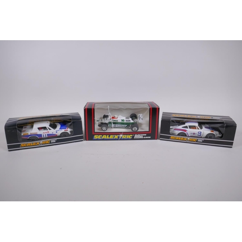 107 - Three 1970s/80s Scalextric Cars to incluede a Porsche Turbo 935 C.125, a Triumph TR7 C.130, and a Sa... 