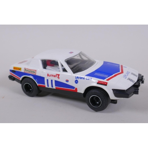 107 - Three 1970s/80s Scalextric Cars to incluede a Porsche Turbo 935 C.125, a Triumph TR7 C.130, and a Sa... 