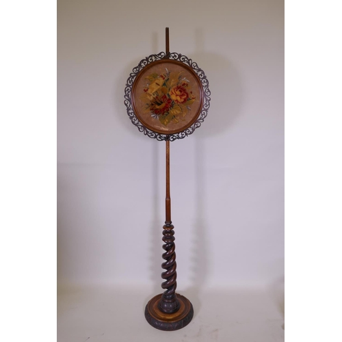 1078 - A C19th mahogany barley twist pole screen with embroidered panel, 162cm high