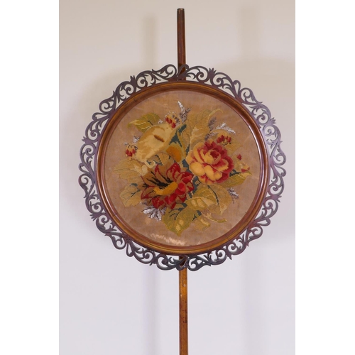 1078 - A C19th mahogany barley twist pole screen with embroidered panel, 162cm high