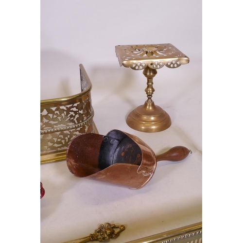 1079 - An antique pierced brass fire fender and another smaller, together with a collection of copper, bras... 