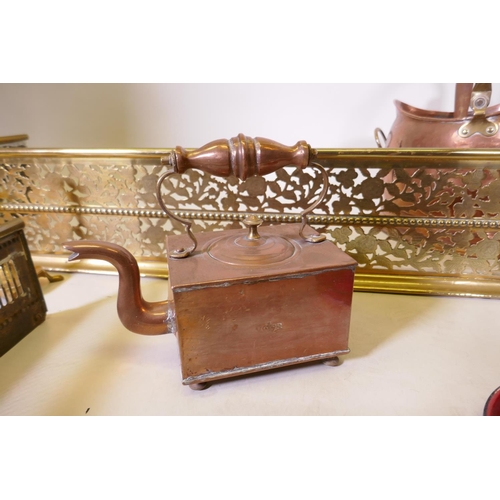 1079 - An antique pierced brass fire fender and another smaller, together with a collection of copper, bras... 